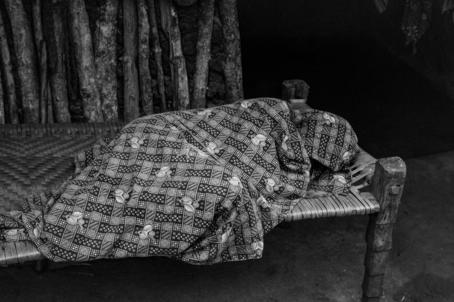 A sick man rests during the day at Tellarayigudem.