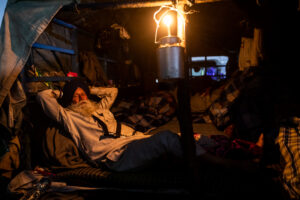 A farmer rests in his tractor trolley in the evening. December 09, 2020.