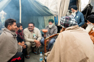 Farmers from Punjab and the neighbouring Haryana, where Singhu is located, share a hookah at the protest site. December 10, 2020.