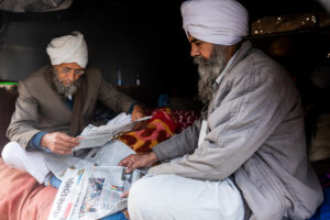 Farmers read the papers in their tractor trolley at Singhu. December 10, 2020.
