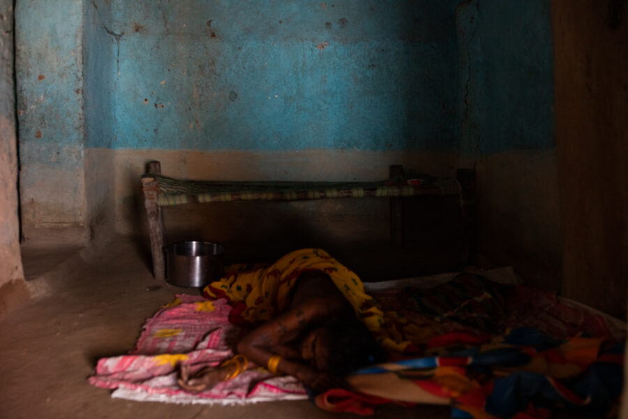 An old woman, suspected of having COVID-19, was left with no medical attention in a room in Jakad Bandha in the Achanakmar Tiger Reserve in Mungeli, Chhattisgarh. Health workers from the JSS convinced her son to bring her later that evening to the hospital, seventy kilometres away in Ganiyari, but the family decided to take her back after being told that her condition was serious. “We’re leaving it up to god,” they said. May 19, 2021.