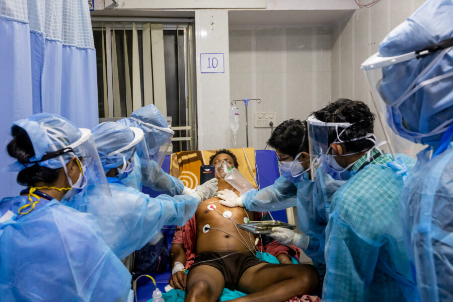 Doctors attend to Mithau Ram, 45, who was admitted in a critical condition, in the ICU run by Sangwari at the Government Medical College Hospital in Ambikapur in Surguja, Chhattisgarh. May 23, 2021.