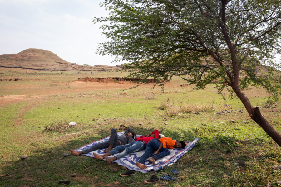 Members of a wedding band catch up on some sleep before their next event at a wedding outside Dindori in Madhya Pradesh. The state banned weddings in May, since they were believed to be a major reason for the spread of COVID-19 in villages. Local marriage-registrar offices were ordered to not issue marriage certificates for couples who married during this period and to even file cases against them. May 27, 2021.