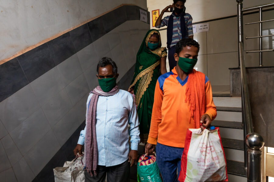 Saraswati Bhurkhuriya, 22, follows her husband Suvilal, 23 in orange shirt, leave after being discharged from the COVID-19 ward at Shaheed Hospital in Balod, Chhattisgarh, India. Saraswati, married for seven months and six months pregnant, had to be convinced by the doctors at Shaheed to get admitted after testing positive for COVID-19 and was one of the last three patients who were discharged together from the ward, after which it was locked up and fumigated. June 16, 2021.