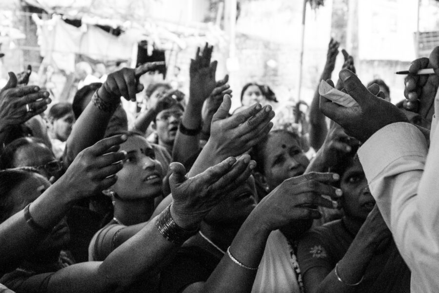 Junior artistes try to get the attention of a casting agent who was picking extras for a movie shoot in Hyderabad. May 2012.