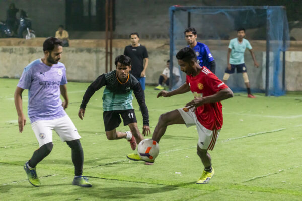 Members of the Rohingya community play football at a ground near Balapur in Hyderabad, India. December 17, 2021.