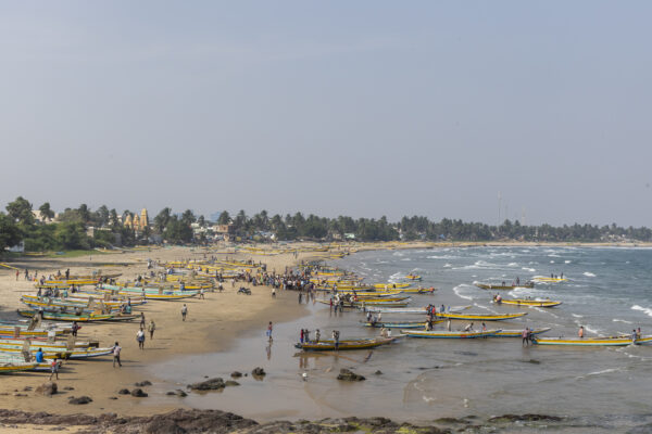 16 November 2022, Pudimadaka, Andhra Pradesh, India- Fishermen return to the landing point on the beach after a hunt.  This photo mission has been supported by Central Institute of Fisheries Technology (ICAR- CIFT), India.