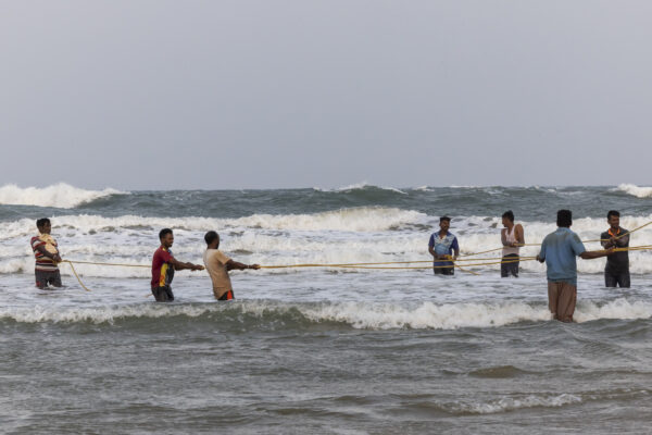 18 November 2022, Mangamaripeta, Andhra Pradesh, India- Fishermen pull boats anchored in the sea into a creek as a cyclone warning was issued in the Bay of Bengal and the sea turned rough.  This photo mission has been supported by Central Institute of Fisheries Technology (ICAR- CIFT), India.