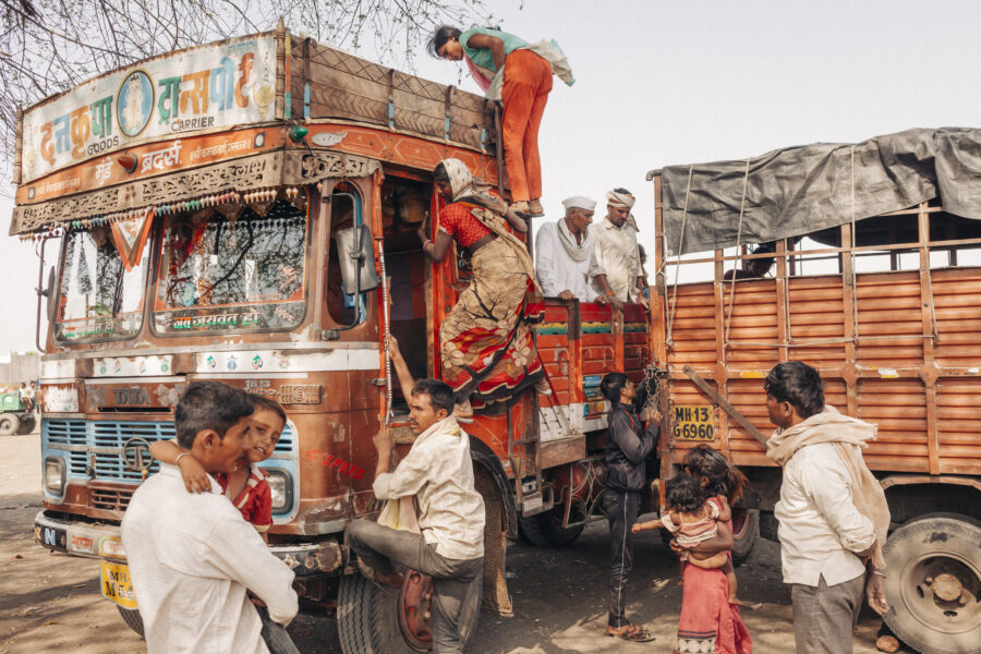 Migrant workers returning from a sugar mill in neighbouring Karnataka, transfer to smaller vehicles at Dharur in Beed, Maharahstra, where they also shop for gifts and essential items before continuing onwards to their respective villages. March 23, 2016.