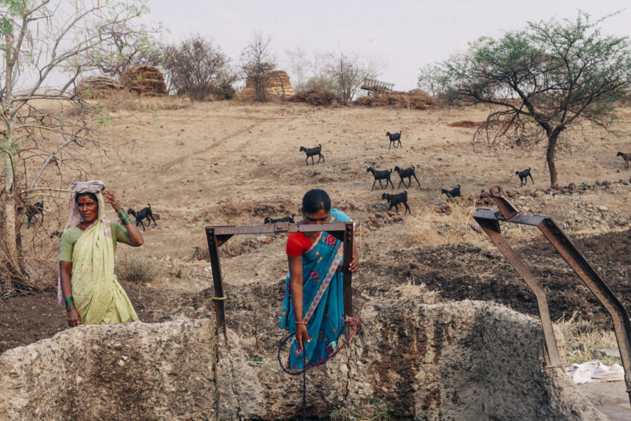 Women draw water from a well, which has long since gone dry but replenished once a day with water from tankers, at Karigaon in Beed, Maharshtra. March 25, 2016