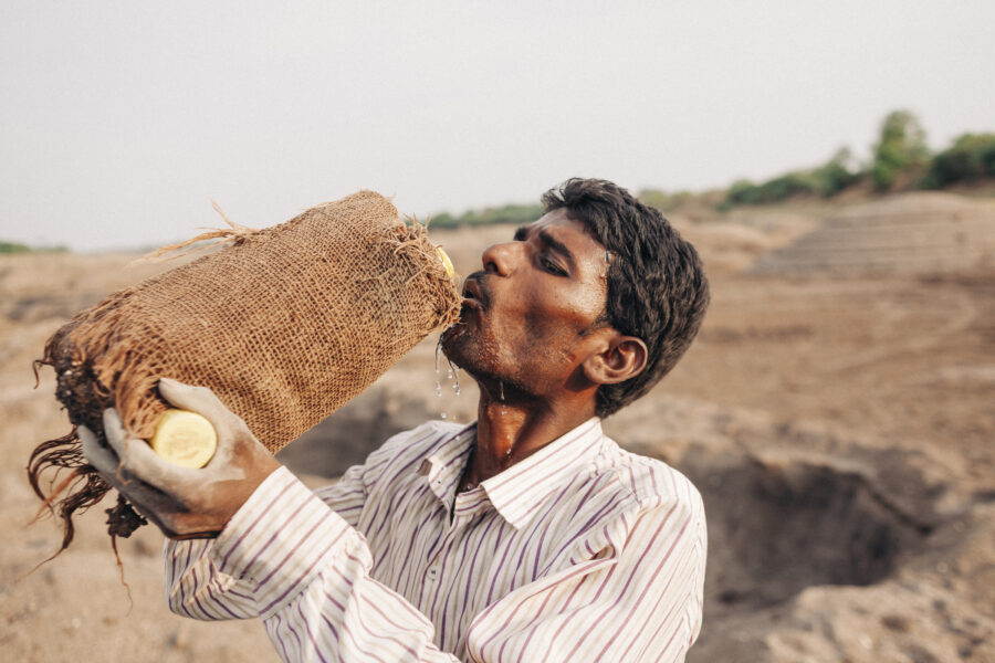 A farmer drinks from his water bottle in Gangawadi, Beed, Maharashtra. April 28, 2016.