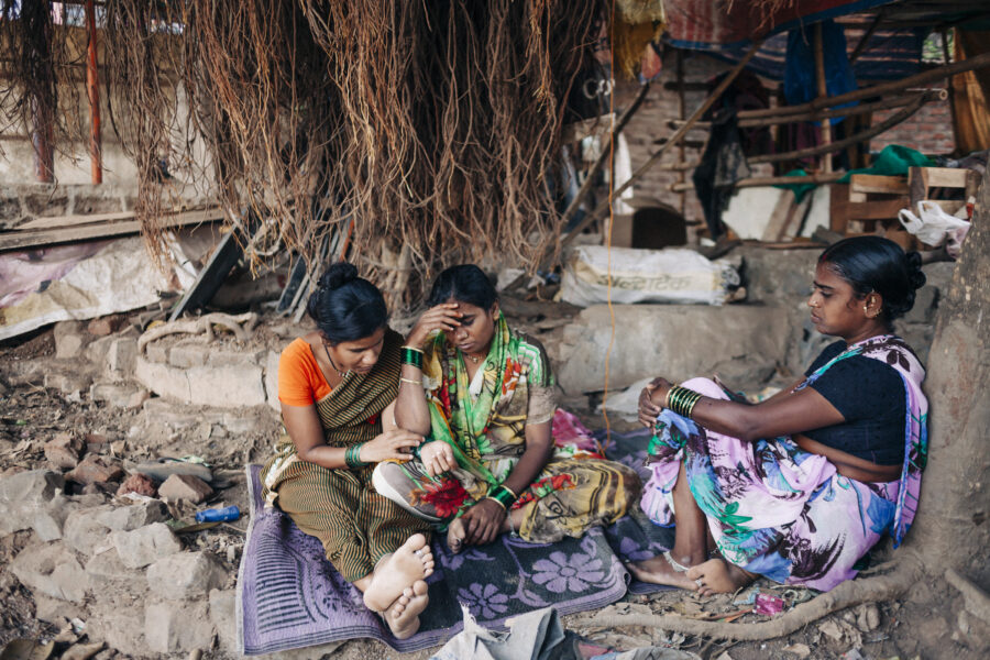 Women from Panegaon in Jalna, Maharashtra rest under a tree after failing to find work during the day at the camp in Ghatkopar, Mumbai.