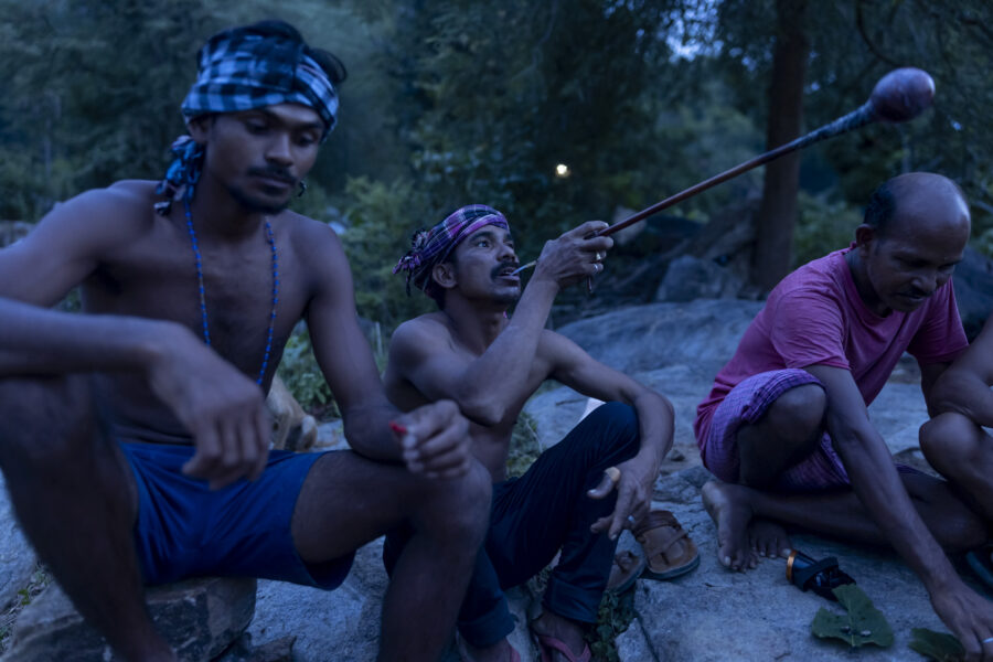 Men gather at a Gasal (drinking circle) for freshly tapped Sindisaal (toddy from silver date palm, Phoenix sylvestris) in Sogad, Odisha, India. The Sora’s preferred drink was Alin, which they tapped from the fishtail palm tree (Caryota urens), followed by Aba, tapped from Mahua (Madhuca indica). Alin was also demanded by the shamans, ancestors and spirits during rituals.