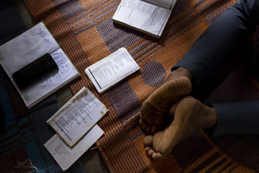 Sora Christian songbooks during a St. John's Day special prayer session at the Roman Catholic Church in Rajingtal in Odisha, India.