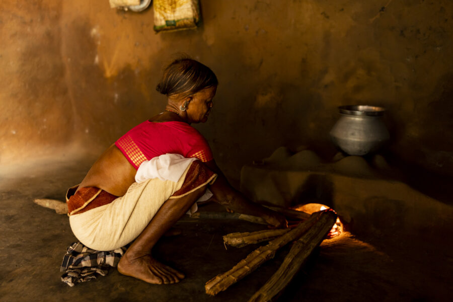 Poyonti Raika cooks a meal for the shamans during a trance ritual in Gudara in Odisha, India.