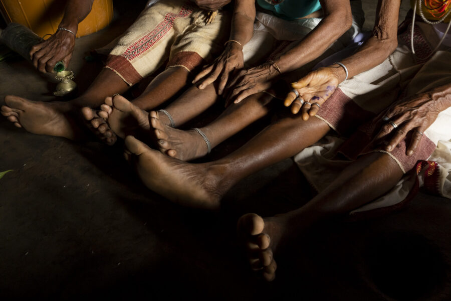 The feet of Sora shamans Sompani Raito, Sindoi Raito and Ilanti Gomongo as they enter a trance in Gudara in Odisha, India. 