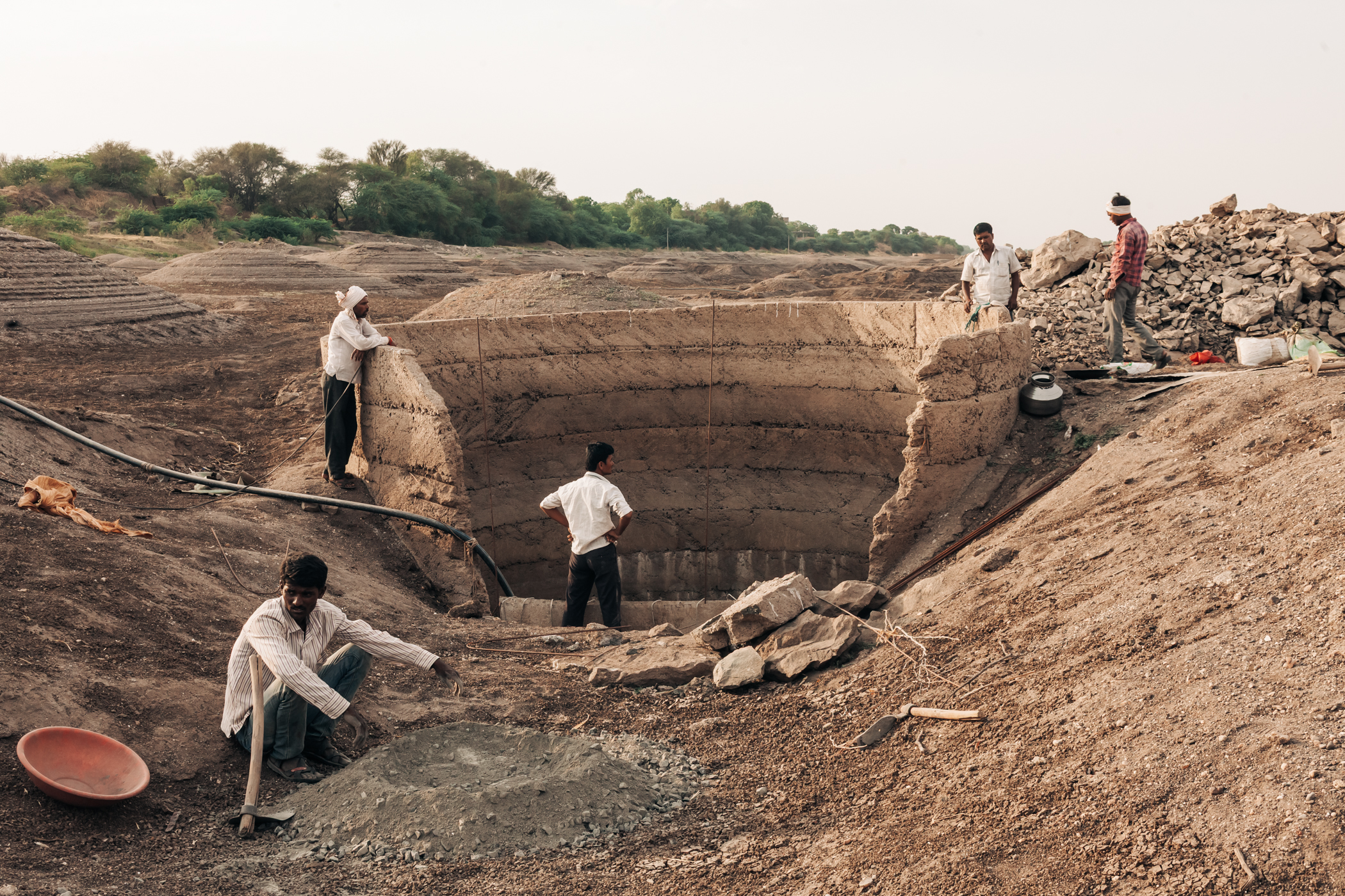 Farmers rebuild an illegal well on the bed of Godavari, the second longest river in India, at Gangawadi in Beed, Maharashtra. April 28, 2016.