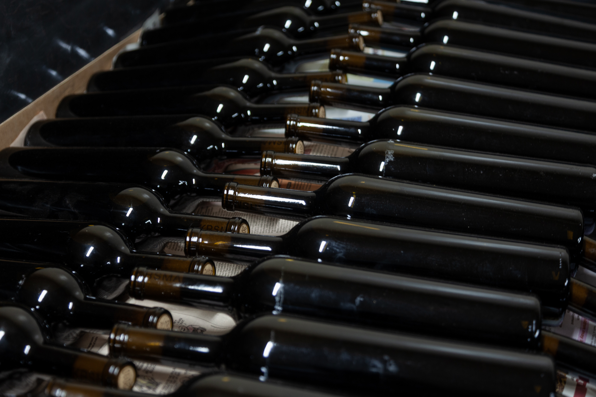 Row of wine bottles photographed with a brand-focused approach, highlighting corporate and brand photography in Bangalore